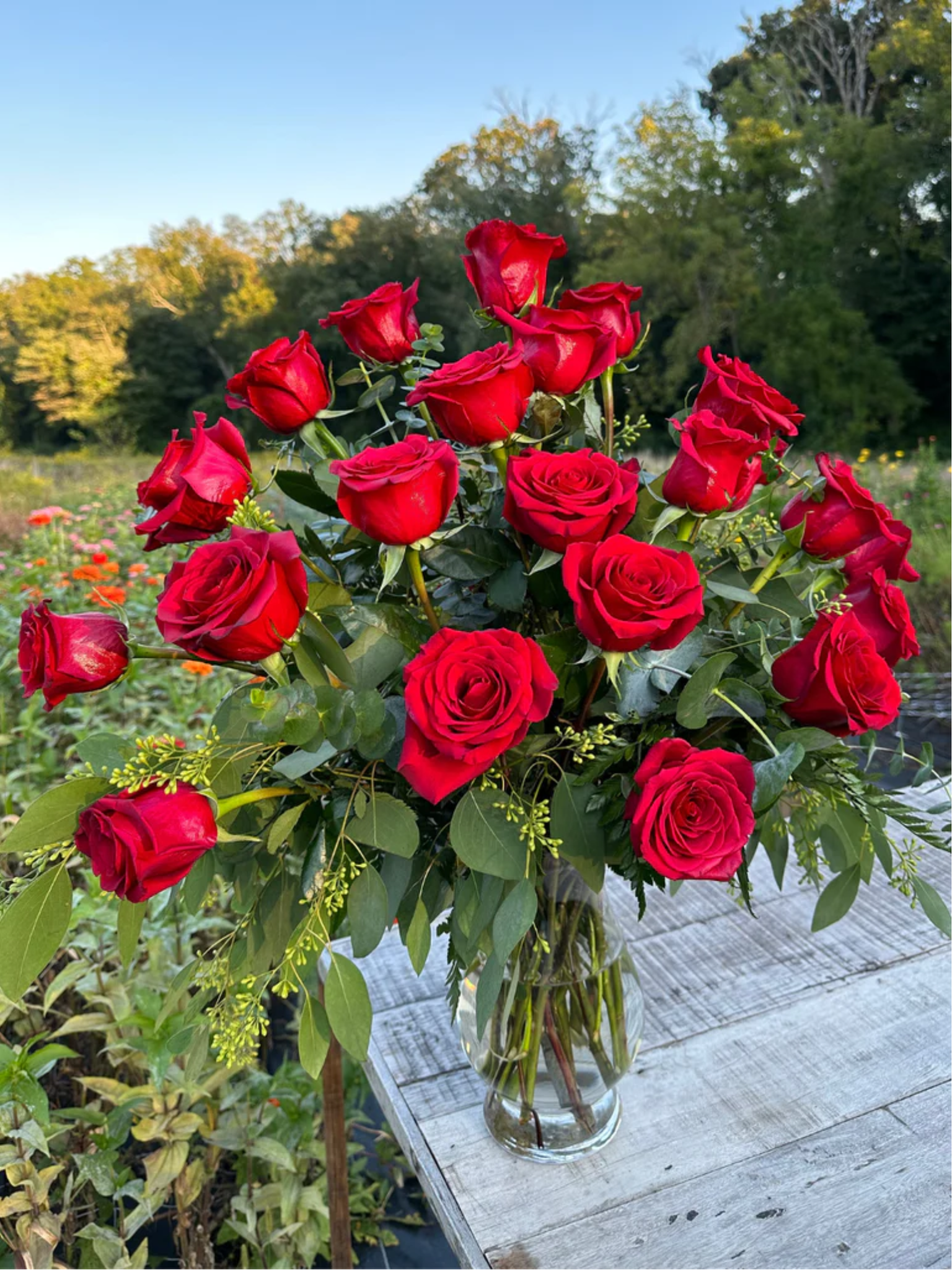 Two dozen red rose flower arrangement from The Flower Cart
